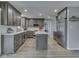 Modern kitchen with gray cabinets, stainless steel appliances, and center island at 2010 Alexandria Dr, Greenfield, IN 46140