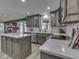 Bright kitchen with gray cabinets, stainless steel appliances, open to dining and living areas at 2010 Alexandria Dr, Greenfield, IN 46140