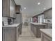 A beautifully lit kitchen with stainless steel appliances, stone countertops, and lots of room to move at 2010 Alexandria Dr, Greenfield, IN 46140