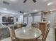 Open-concept with a large table with chairs connecting the living room and dining room at 2010 Alexandria Dr, Greenfield, IN 46140