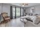 Bright living room with large windows offering natural light, comfortable seating and decor at 2010 Alexandria Dr, Greenfield, IN 46140