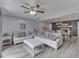 Open concept living room with a ceiling fan, neutral colors, and a fireplace at 2010 Alexandria Dr, Greenfield, IN 46140