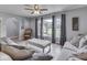 Living room with large windows, recessed lighting, and modern decor at 2010 Alexandria Dr, Greenfield, IN 46140
