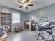Office with hardwood floors, ceiling fan, natural light, desk, printer, and shelving unit at 2010 Alexandria Dr, Greenfield, IN 46140