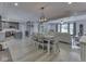 Open floor plan showcasing the kitchen, dining area and a living room with neutral color palette at 2010 Alexandria Dr, Greenfield, IN 46140