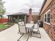 Outdoor patio area featuring comfortable seating, perfect for enjoying the serene backyard view at 2010 Alexandria Dr, Greenfield, IN 46140
