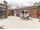 Brick home featuring a spacious patio perfect for outdoor dining and entertaining guests at 2010 Alexandria Dr, Greenfield, IN 46140