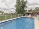 Sparkling in-ground pool with decking and lounge chairs, perfect for outdoor relaxation and entertainment at 2010 Alexandria Dr, Greenfield, IN 46140