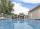 This in-ground pool with clear, blue water, surrounded by a white fence is ready for summer fun! at 2010 Alexandria Dr, Greenfield, IN 46140