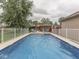 Inviting in-ground pool with a surrounding fence, ideal for summer fun and relaxation at 2010 Alexandria Dr, Greenfield, IN 46140