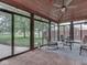 Sunroom featuring an indoor/outdoor living area, comfortable seating, and a view of the backyard at 2010 Alexandria Dr, Greenfield, IN 46140