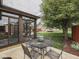 Enclosed sunroom with an adjacent patio area, complemented by outdoor seating at 2010 Alexandria Dr, Greenfield, IN 46140