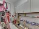 This is a spacious workshop featuring ample storage, an air compressor, and room to complete projects at 2010 Alexandria Dr, Greenfield, IN 46140