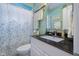 Well-lit bathroom featuring a modern vanity, sleek fixtures, and a stylish shower curtain at 2021 Chestnut St, Columbus, IN 47201