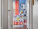 Cozy bedroom with colorful floral bedding and coral curtains, creating a bright and cheerful atmosphere at 2021 Chestnut St, Columbus, IN 47201