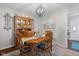 Traditional dining room features a wooden table, chairs and hutch, creating a warm, inviting atmosphere at 2021 Chestnut St, Columbus, IN 47201