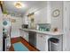 The kitchen with white cabinets, stainless steel appliances, and plenty of counter space for meal preparation at 2021 Chestnut St, Columbus, IN 47201