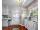 Bright kitchen features white cabinetry, stainless steel appliances, and a window for natural light at 2021 Chestnut St, Columbus, IN 47201