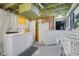 Basement laundry area with washer, dryer, and storage cabinets at 2021 Chestnut St, Columbus, IN 47201