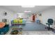 Spacious basement Gathering room with dining table and blue accents at 2021 Chestnut St, Columbus, IN 47201