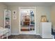 Open-concept living room with white shelving and a view of the dining room enhancing the sense of space at 2021 Chestnut St, Columbus, IN 47201