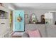 View of the living room showcasing a charming blue door and comfortable seating area at 2021 Chestnut St, Columbus, IN 47201