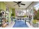 Cozy sunroom with wicker furniture, fern, and a view of the outdoors at 2021 Chestnut St, Columbus, IN 47201