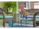 Charming sunroom filled with wicker furniture and colorful plants, perfect for relaxation at 2021 Chestnut St, Columbus, IN 47201