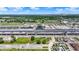 Racetrack with a grandstand, surrounded by neatly organized parking, green space, and the distant city skyline at 2110 Fisher Ave, Speedway, IN 46224