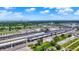 Expansive racetrack complex showcasing grandstands, parking, and the city skyline against a partly cloudy sky at 2110 Fisher Ave, Speedway, IN 46224