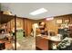 Wood-paneled basement area with desk, shelving, and decor, perfect for an office or hobby space at 2110 Fisher Ave, Speedway, IN 46224