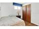 Bedroom featuring hardwood floors, closet, and twin bed with quilt at 2110 Fisher Ave, Speedway, IN 46224