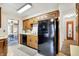 Vintage kitchen with wood cabinetry and views into adjoining breakfast nook at 2110 Fisher Ave, Speedway, IN 46224