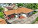 Aerial view of the home showing the roof, outdoor patio, and backyard space with mature landscaping at 2110 Fisher Ave, Speedway, IN 46224