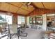 Relaxing sunroom featuring a ceiling fan, windows and dining set at 2110 Fisher Ave, Speedway, IN 46224