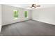 Bright, open bedroom with neutral walls, large windows offering natural light and plush carpeting at 2116 Orchid Bloom Dr, Indianapolis, IN 46231