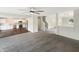 Open concept living area with updated kitchen, adjacent staircase, and view to the front entrance at 2116 Orchid Bloom Dr, Indianapolis, IN 46231