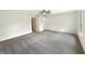 Spacious main bedroom with neutral carpeting and paint with view to walk-in closet and bathroom at 2116 Orchid Bloom Dr, Indianapolis, IN 46231