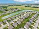 Community aerial showcasing a neighborhood's layout, streets, landscaping, and proximity to natural green spaces at 220 Sawdust Trl, Greenfield, IN 46140