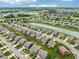 Aerial view of a residential neighborhood highlighting the community layout, green spaces, and nearby amenities at 220 Sawdust Trl, Greenfield, IN 46140