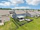 Well-maintained backyard featuring a covered patio, fire pit, and black aluminum fencing at 220 Sawdust Trl, Greenfield, IN 46140