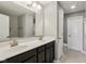 Modern bathroom featuring a double sink vanity, large mirror, and neutral color palette at 220 Sawdust Trl, Greenfield, IN 46140