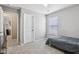 Bright bedroom featuring a bed with grey linens, natural light, carpeted floors and neutral paint at 220 Sawdust Trl, Greenfield, IN 46140