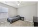 Simple bedroom featuring a bed, grey linens, and natural light from a window at 220 Sawdust Trl, Greenfield, IN 46140