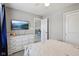 Bright bedroom featuring a white dresser, carpeted floors and tv mounted on the wall at 220 Sawdust Trl, Greenfield, IN 46140