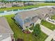 Inviting two-story home with a beautifully landscaped front yard and picturesque water view at 220 Sawdust Trl, Greenfield, IN 46140