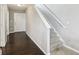 Bright foyer with hardwood floors, a staircase, and natural light, offering a grand entrance at 220 Sawdust Trl, Greenfield, IN 46140