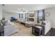 Inviting living room featuring a fireplace, a large screen television, ample seating, and neutral decor at 220 Sawdust Trl, Greenfield, IN 46140