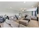 Spacious living room with gray sofas, a large ottoman, and plenty of natural light at 220 Sawdust Trl, Greenfield, IN 46140