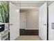 View from the doorway into the office, featuring hardwood floors, a white interior door and a plant at 220 Sawdust Trl, Greenfield, IN 46140
